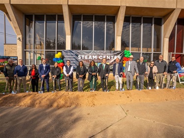 Management Poses for the Groundbreaking Ceremony